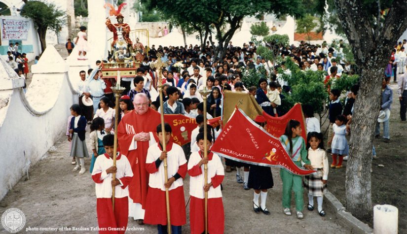 Father Don Mooney, CSB leads procession