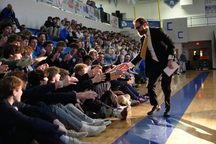 Father Fulton, CSB greets students at one of Catholic Central's daily pep rallies during DRIVE week